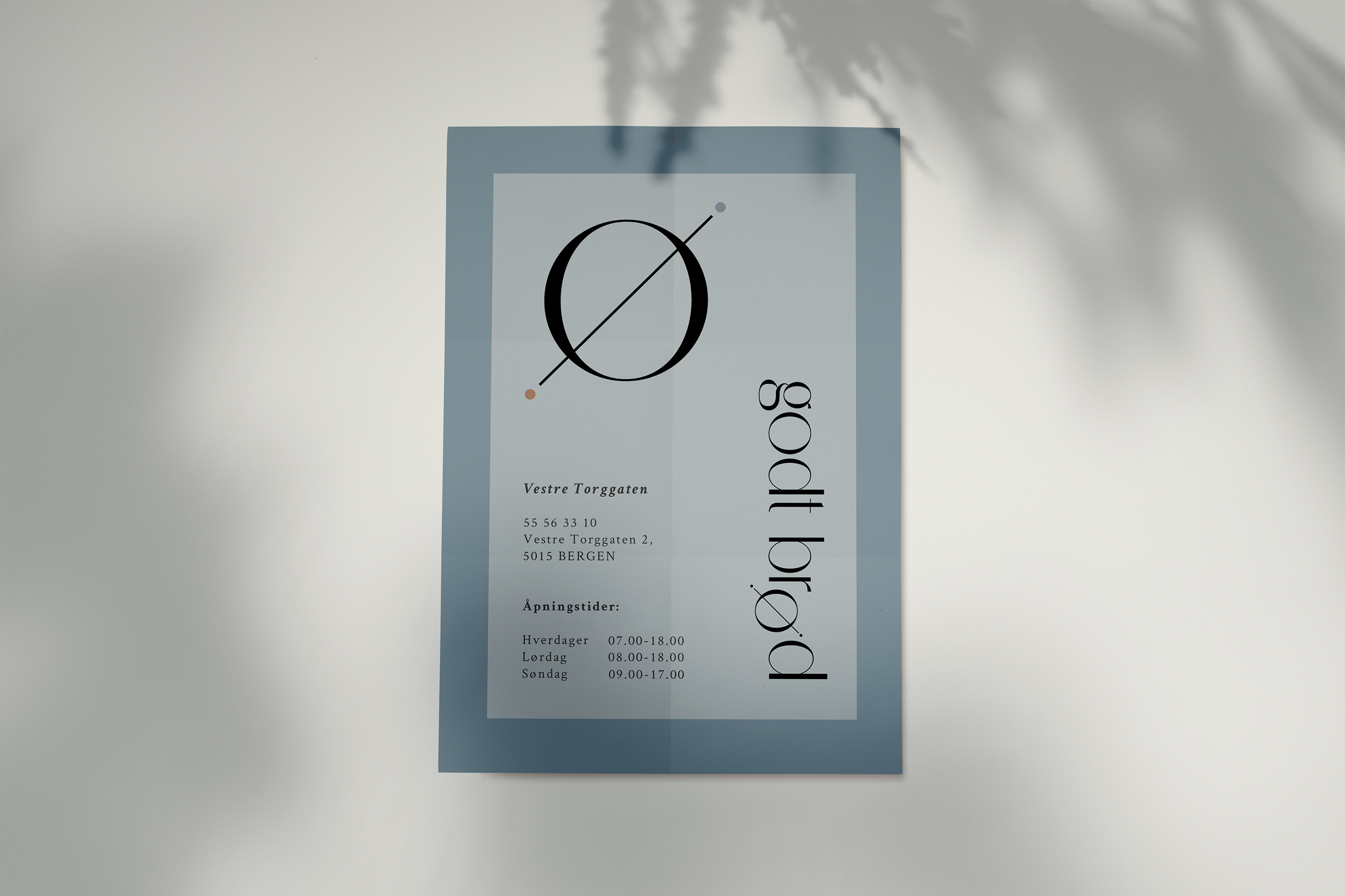 A Godt Brod poster that has the bakery's opening hours and address along with the logo and submark