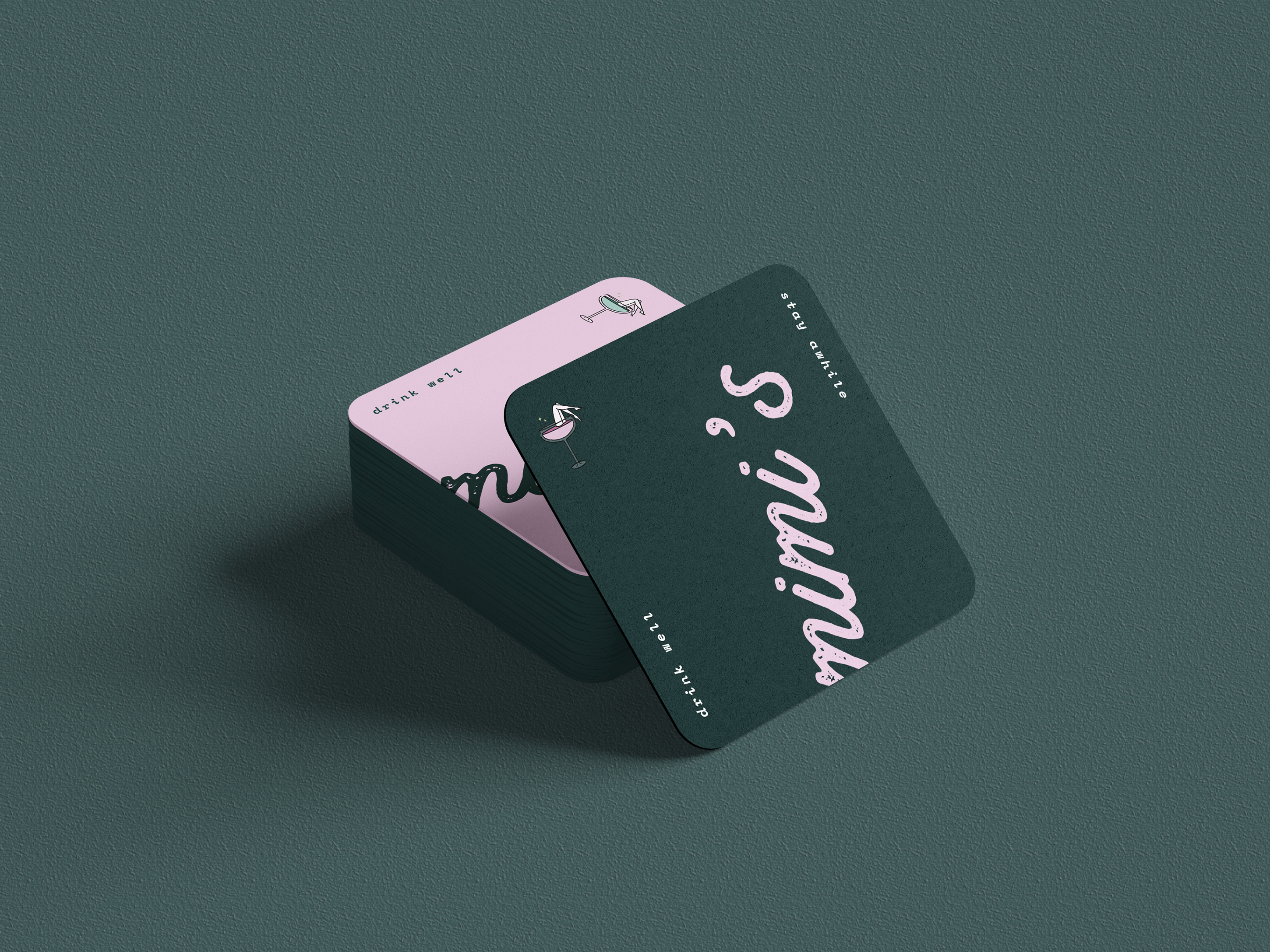 A stack of dark teal Mimis drink coasters