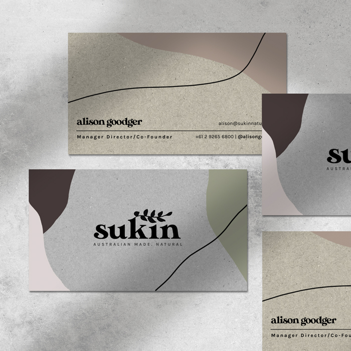 Four business cards for the brand Sukin Skincare